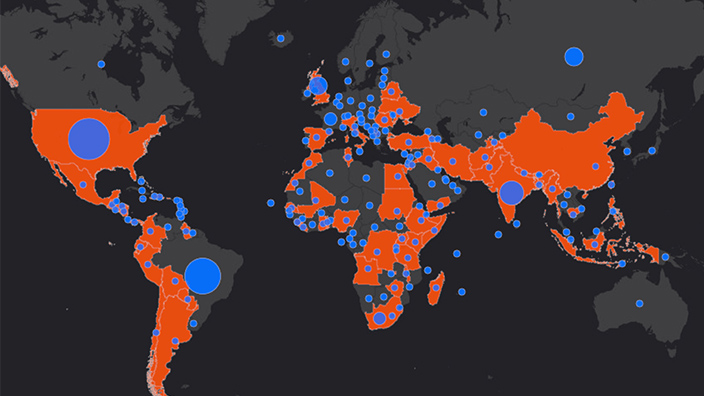 Un sencillo mapamundi con zonas seleccionadas en rojo y azul para representar las operaciones de respuesta de Direct Relief ante la COVID-19