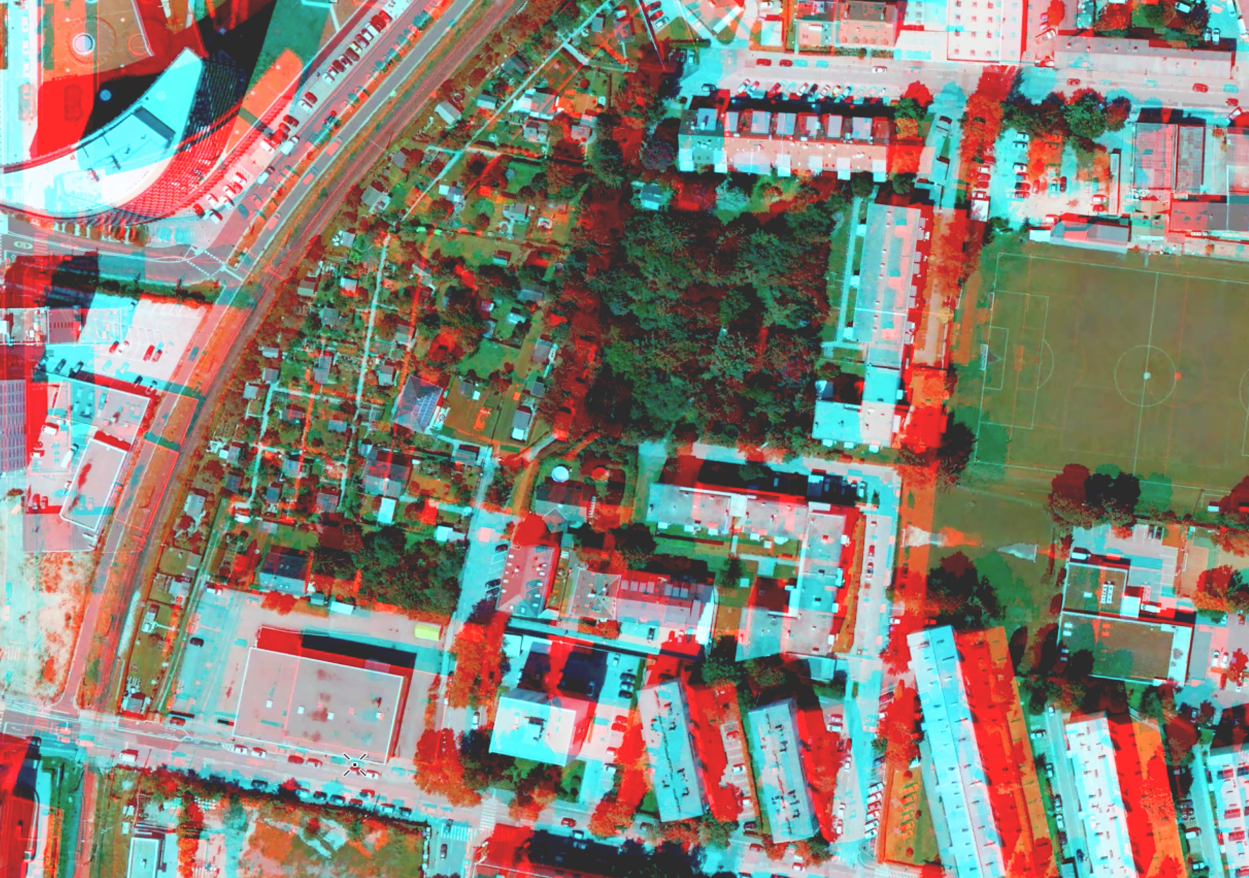 Un mapa estéreo de una zona residencial densa muestra una superposición roja donde se pueden mostrar las entidades en 3D
