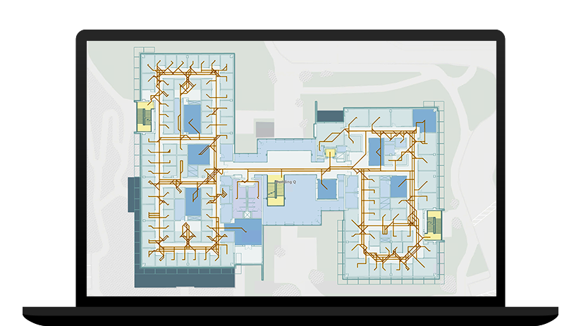 Ordenador portátil que muestra un mapa de interior de un edificio con las rutas de salida resaltadas en amarillo y marrón