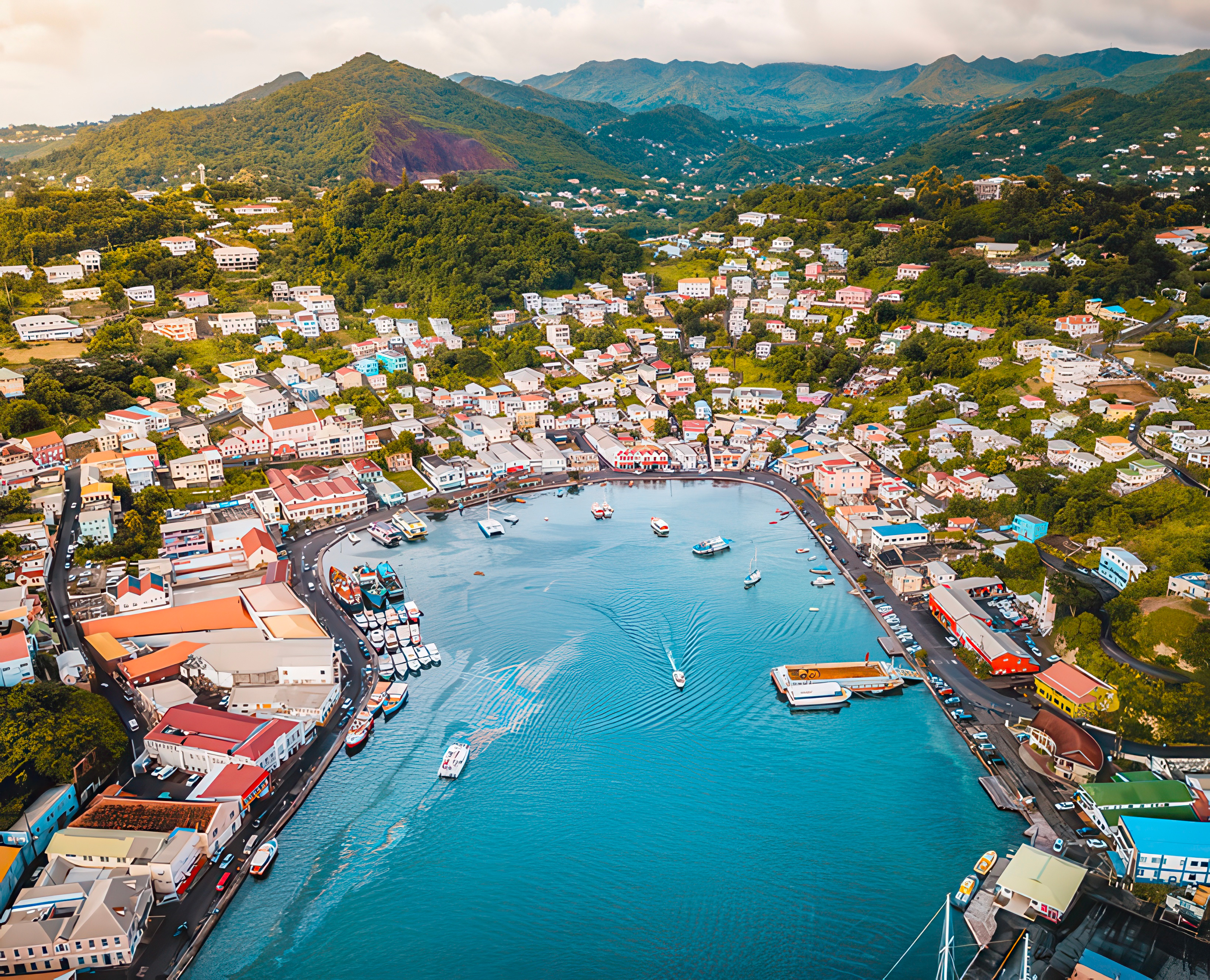 An island nation with rich green mountains and a busy dock