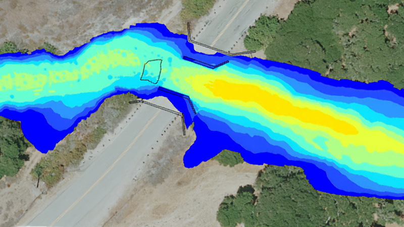 Un gradiente de color azul y amarillo atraviesa una calzada para indicar información medioambiental crítica. 
