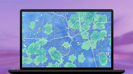 Un gráfico de un monitor de ordenador que muestra un mapa de carreteras en verde y azul sobre un fondo violeta