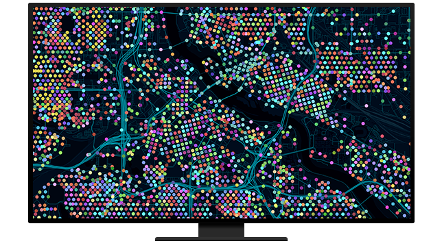 Gráfico de un monitor de ordenador que muestra un mapa de la ciudad con calles azules y muchos puntos de colores sobre un fondo negro