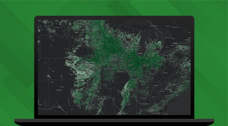 Graphic of a laptop monitor displaying a vegetation map in green and black over a green background