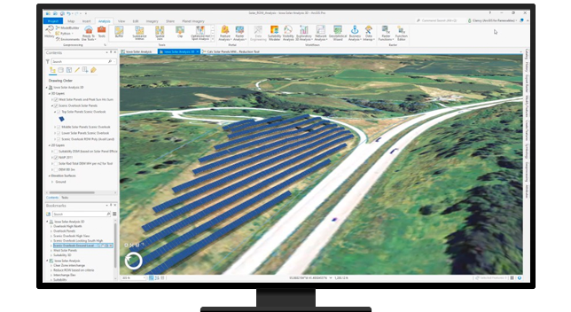 Un ordenador de sobremesa que muestra un mapa en el software ArcGIS con líneas azules añadidas que indican la colocación digital de los paneles solares