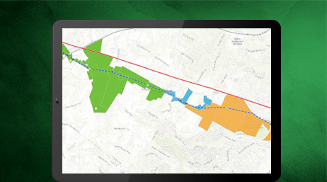 Una tablet que muestra un mapa con una zona resaltada en naranja, azul y verde