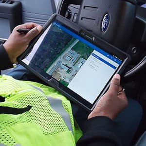 Worker using ArcGIS Online on tablet